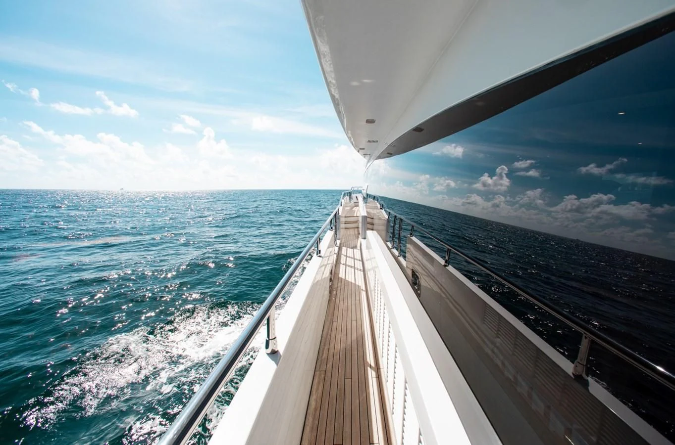 a long wooden bridge over water aboard INDIGO Yacht for Sale