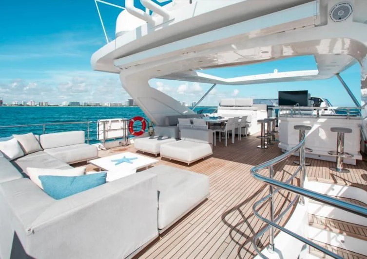 a deck with a large deck and a view of the ocean aboard INDIGO Yacht for Sale