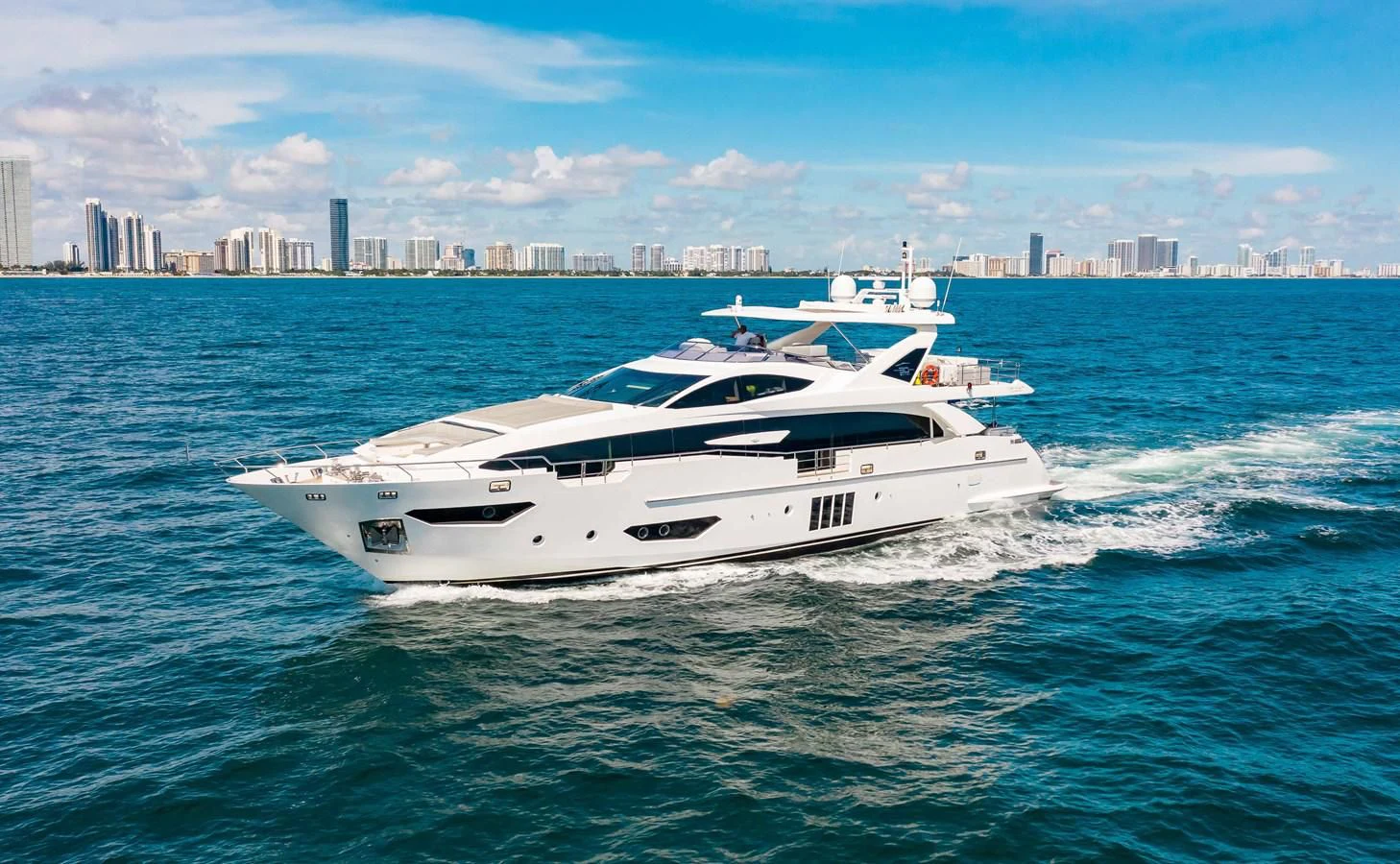 a white yacht in the water aboard INDIGO Yacht for Sale