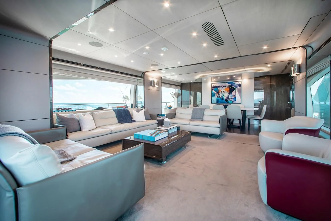 a living room with a large window aboard INDIGO Yacht for Sale