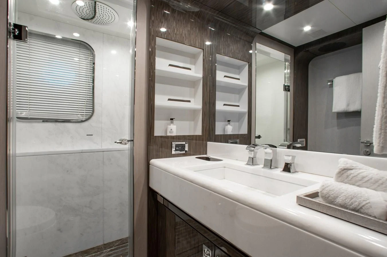 a bathroom with a large mirror aboard INDIGO Yacht for Sale