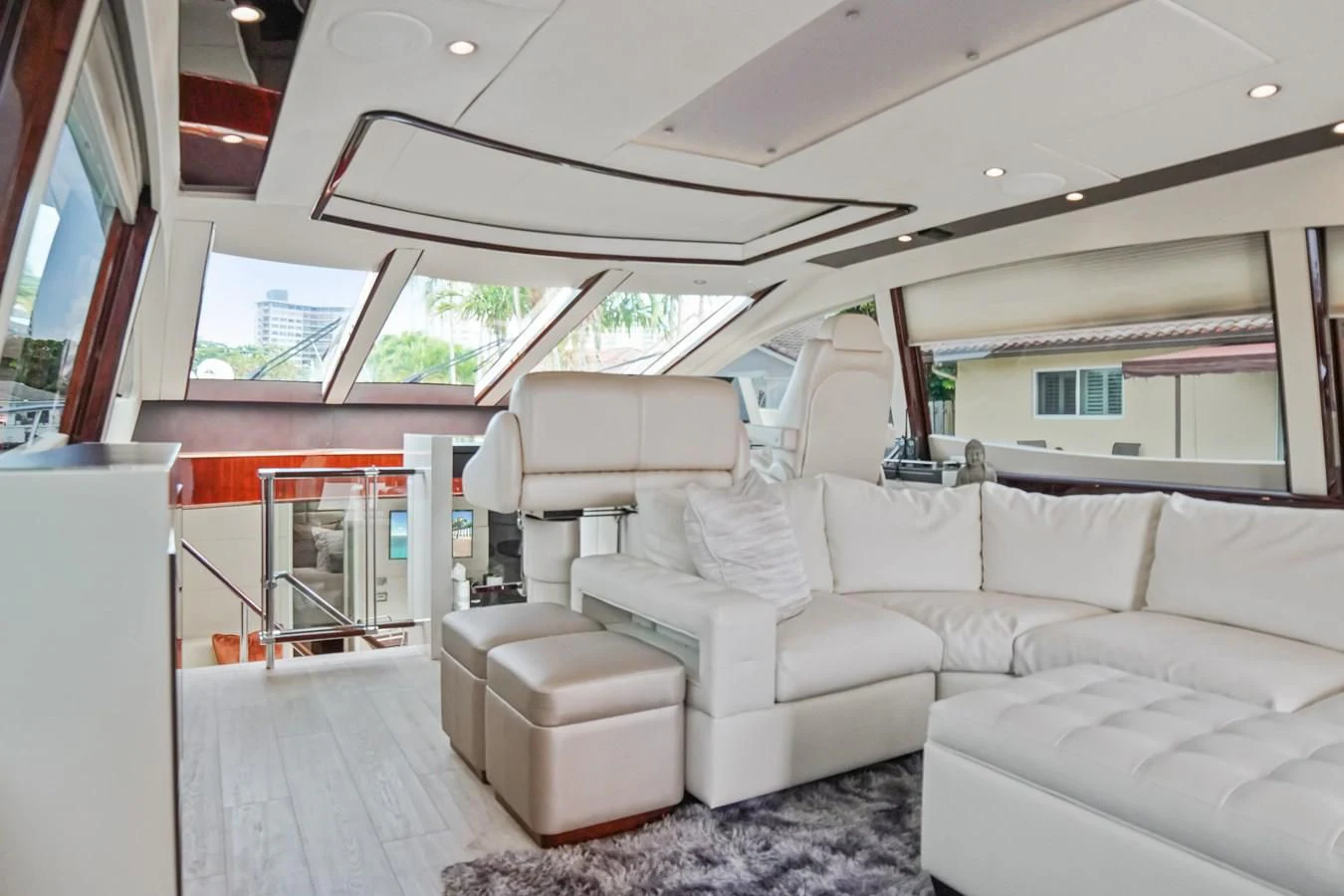 a living room with a couch aboard LAZZARA 68' Yacht for Sale