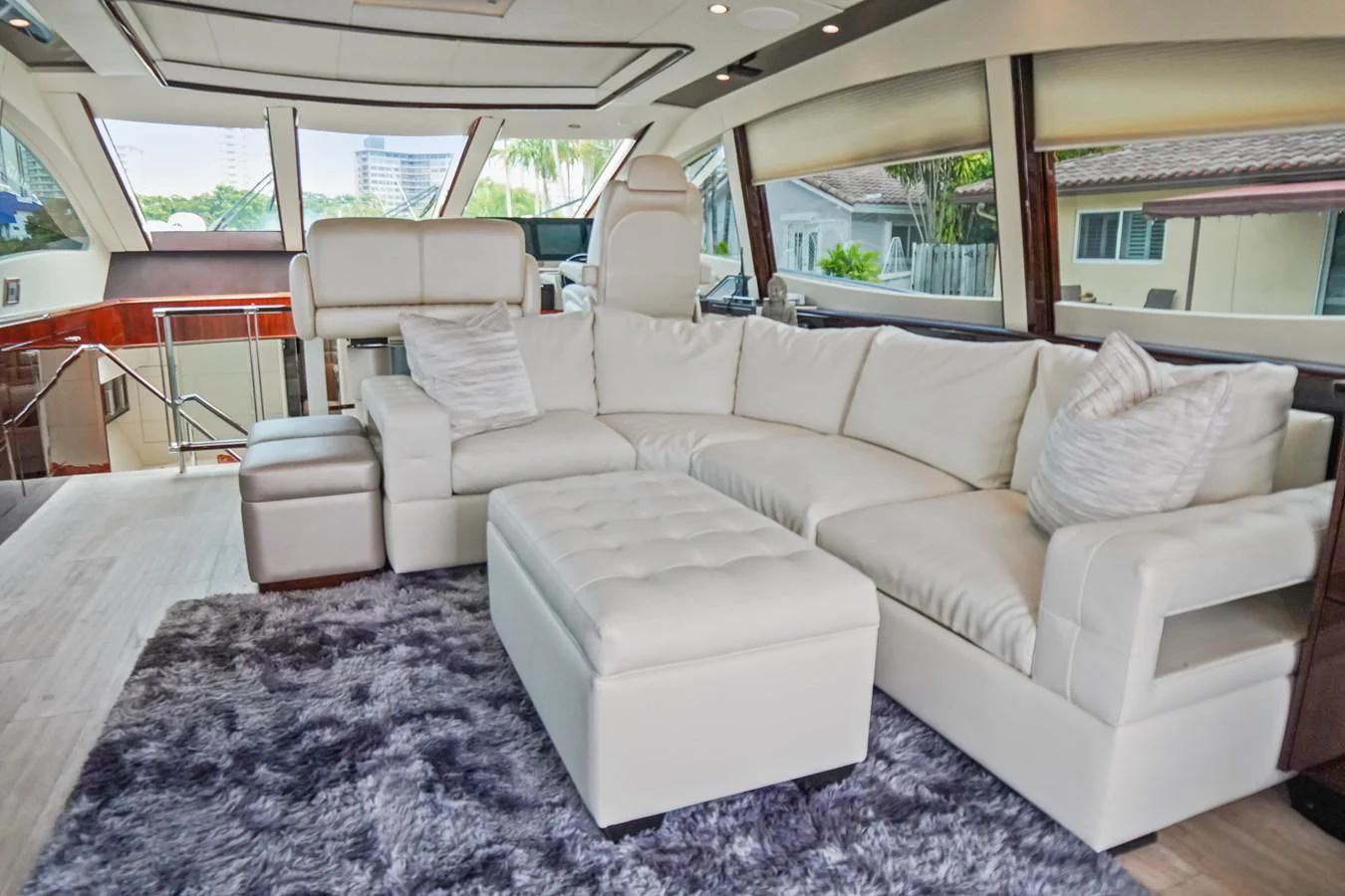 a white couch in a car aboard LAZZARA 68' Yacht for Sale