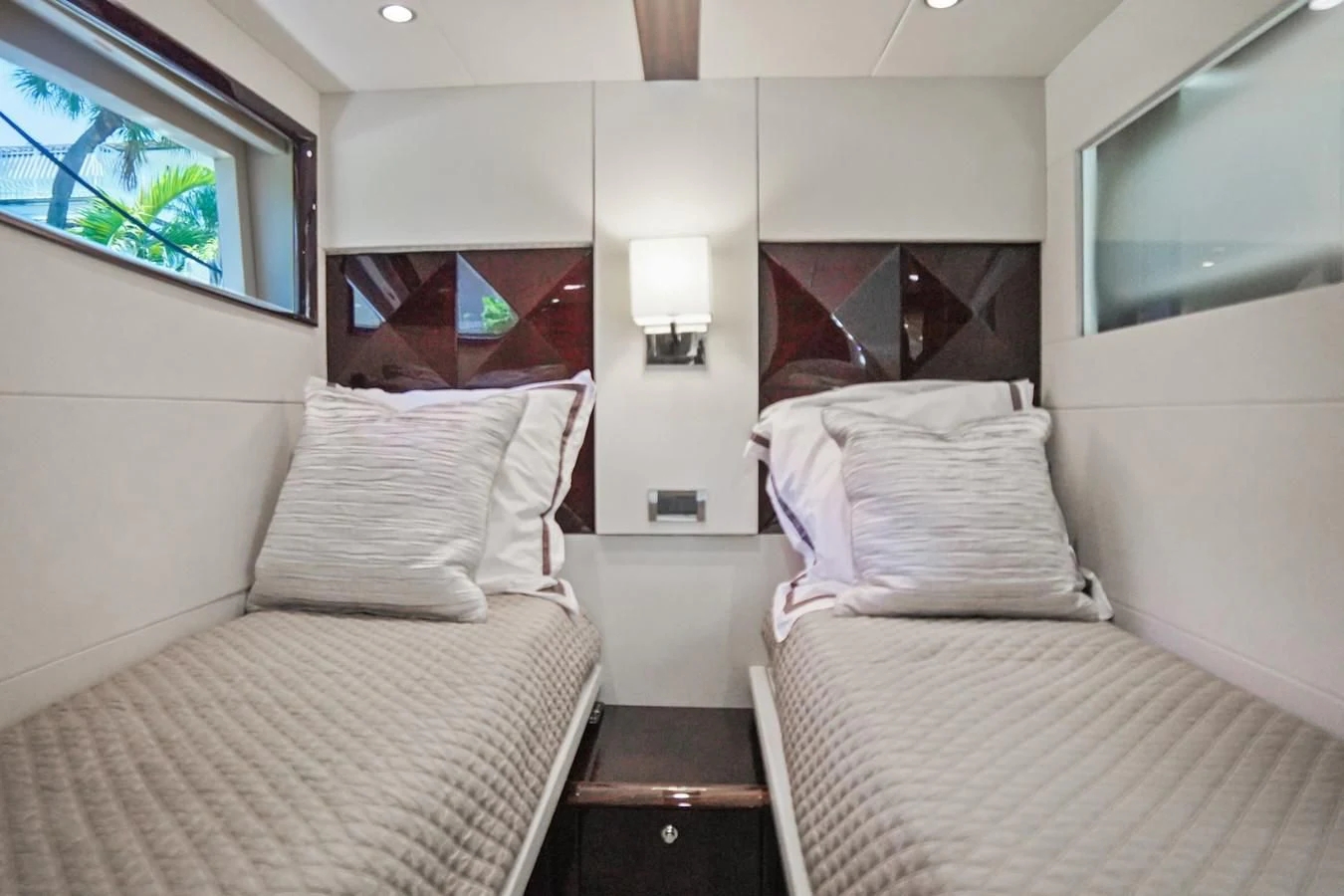 a room with two beds aboard LAZZARA 68' Yacht for Sale