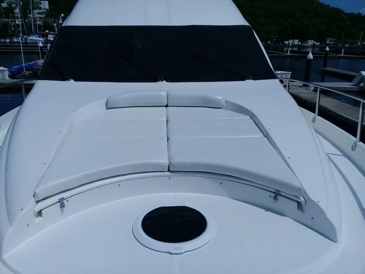 the front of a white boat aboard LAZZARA 68' Yacht for Sale