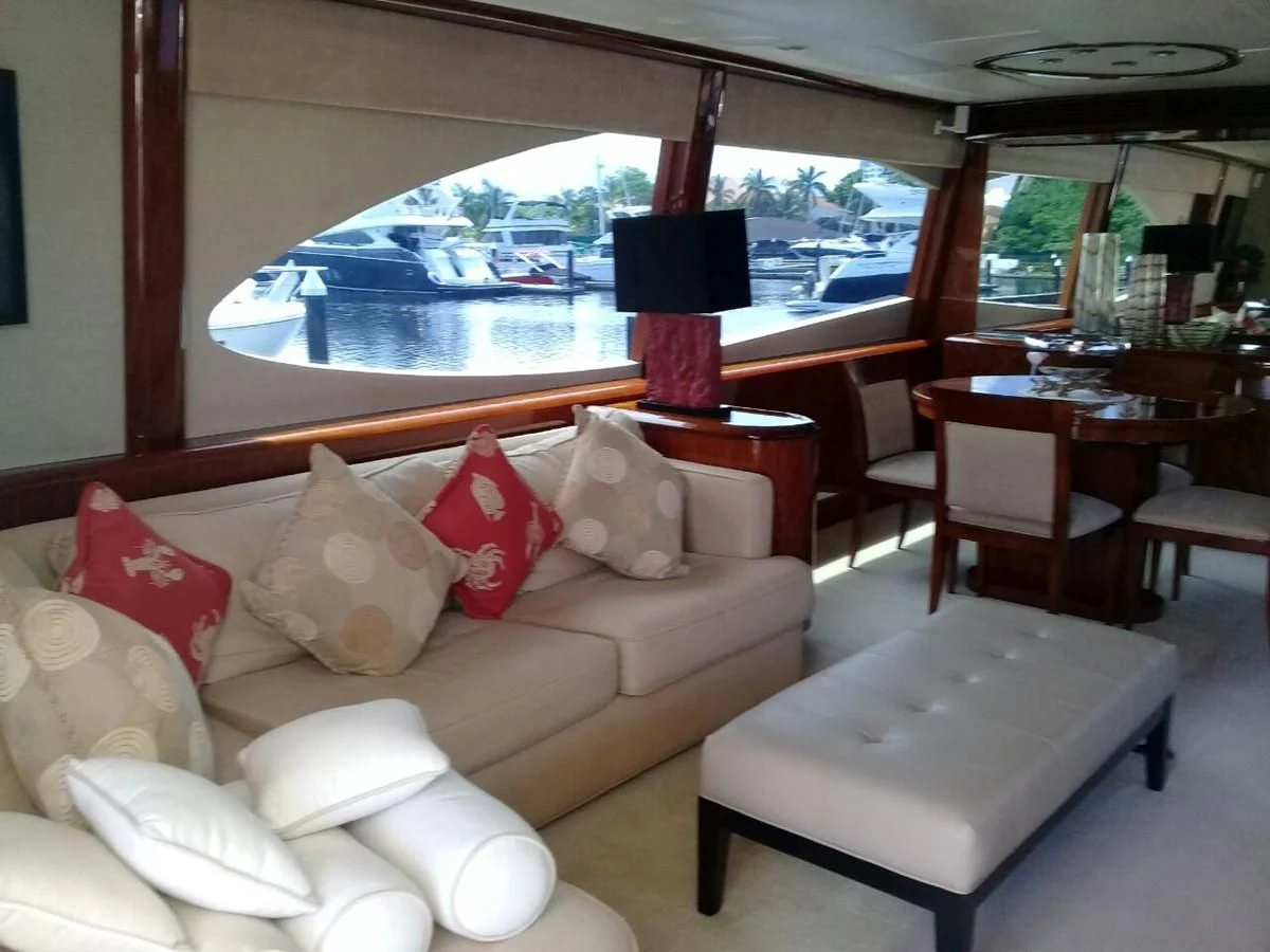 a living room with a large window aboard LAZZARA 68' Yacht for Sale