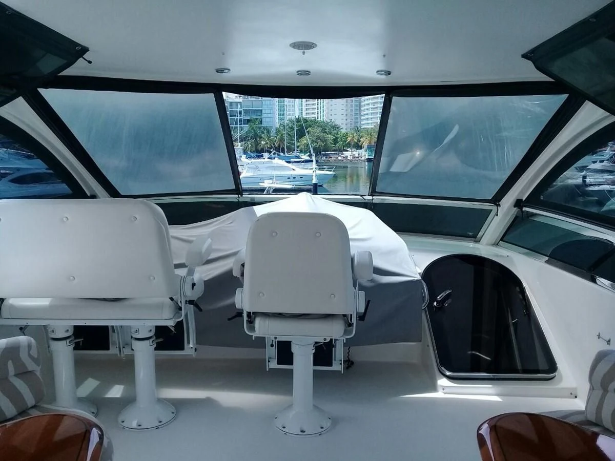 a white car with a white chair aboard LAZZARA 68' Yacht for Sale