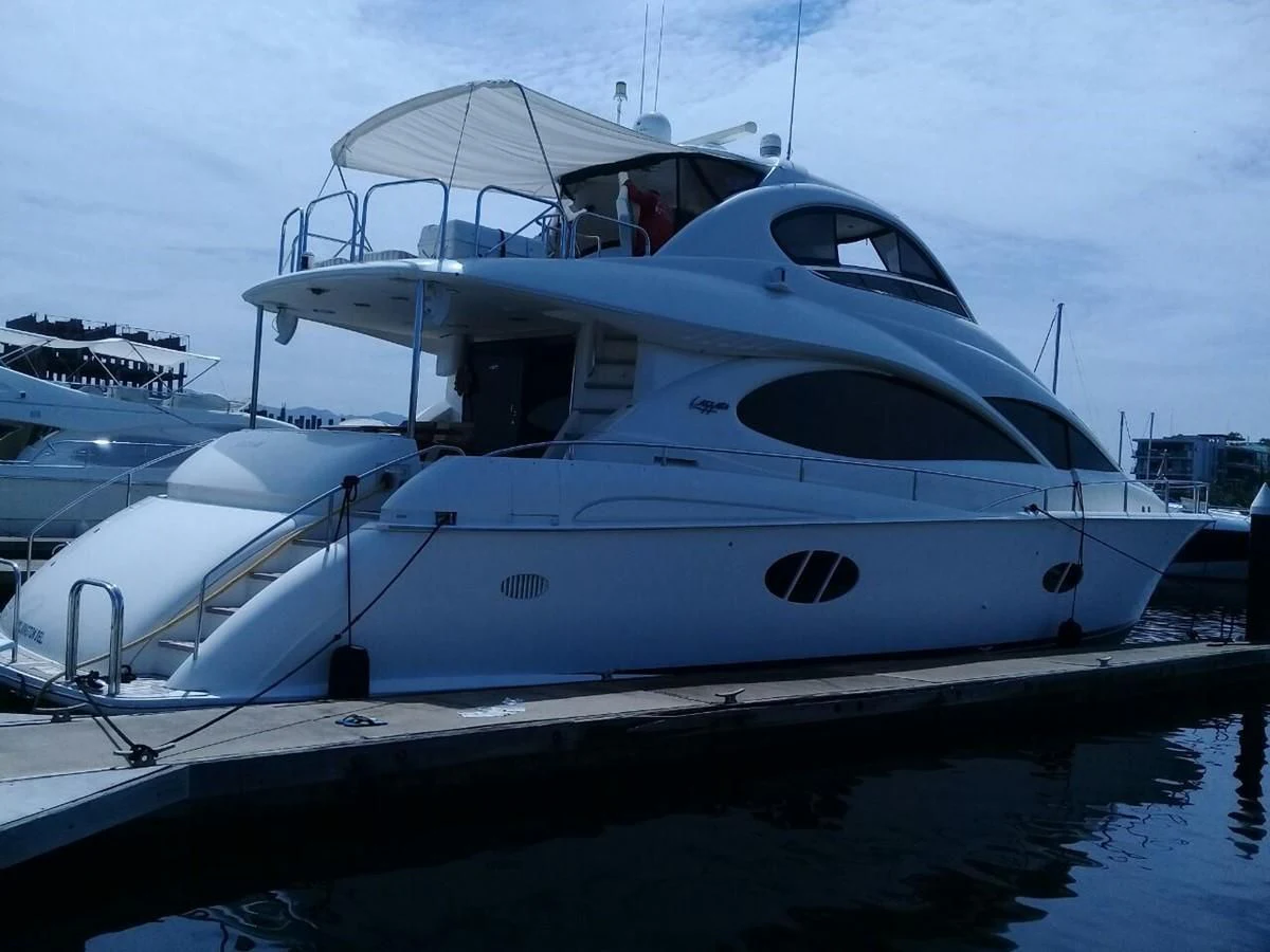 a white yacht on the water aboard LAZZARA 68' Yacht for Sale
