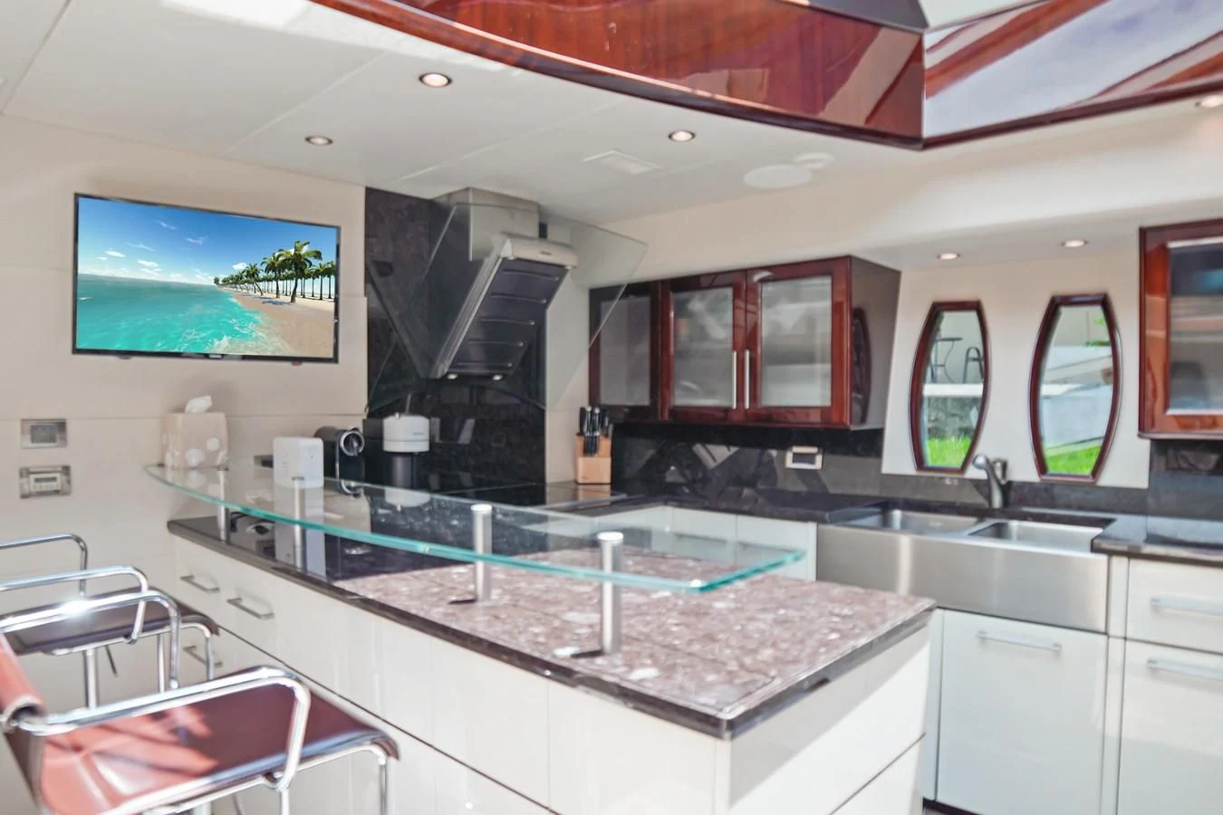 a kitchen with a large island aboard LAZZARA 68' Yacht for Sale