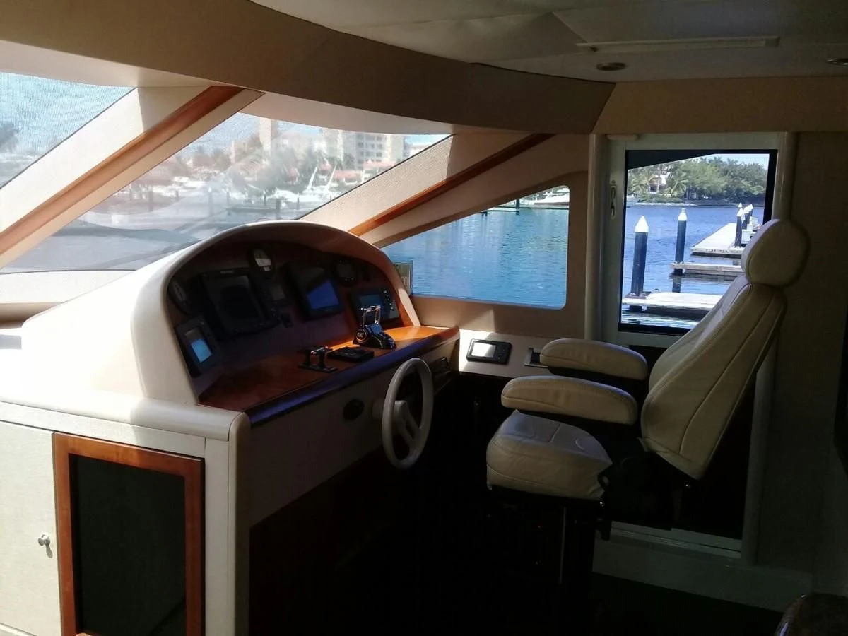a car with a table and chairs aboard LAZZARA 68' Yacht for Sale