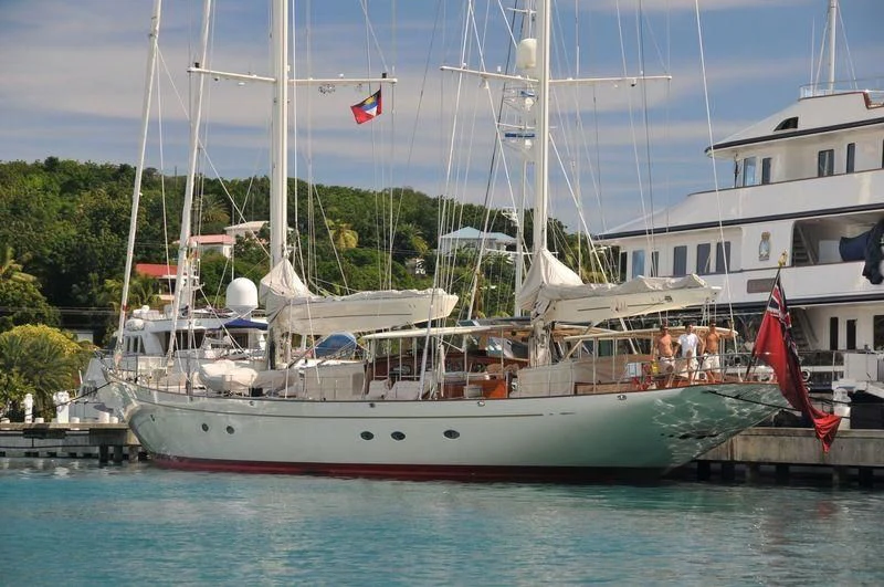 a boat with a flag on the front aboard ADELE Yacht for Sale