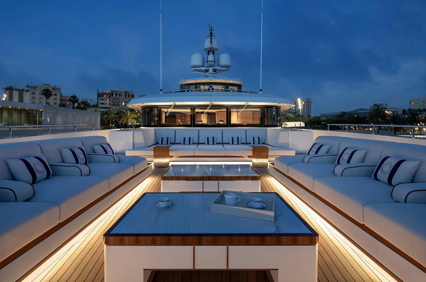 a pool with a view of a city and a large building aboard LUSINE Yacht for Sale