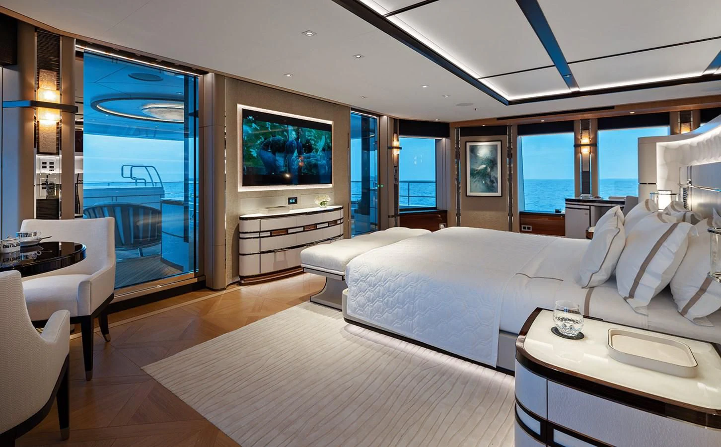 a room with a large bed and a flat screen television aboard LUSINE Yacht for Sale