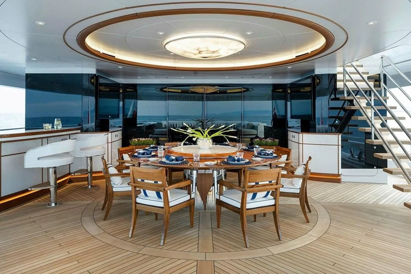 a large room with tables and chairs aboard LUSINE Yacht for Sale