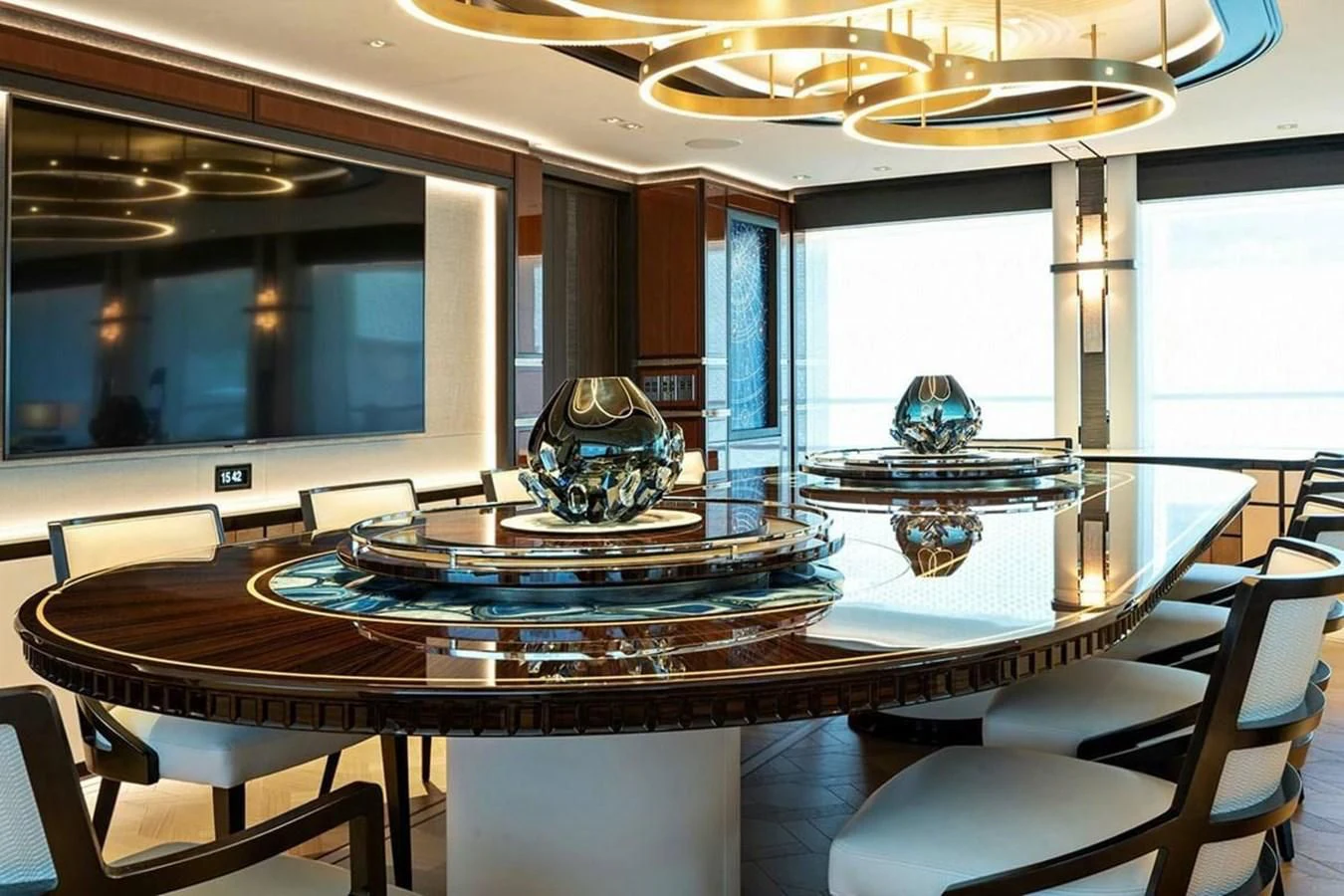 a large room with a table and chairs aboard LUSINE Yacht for Sale