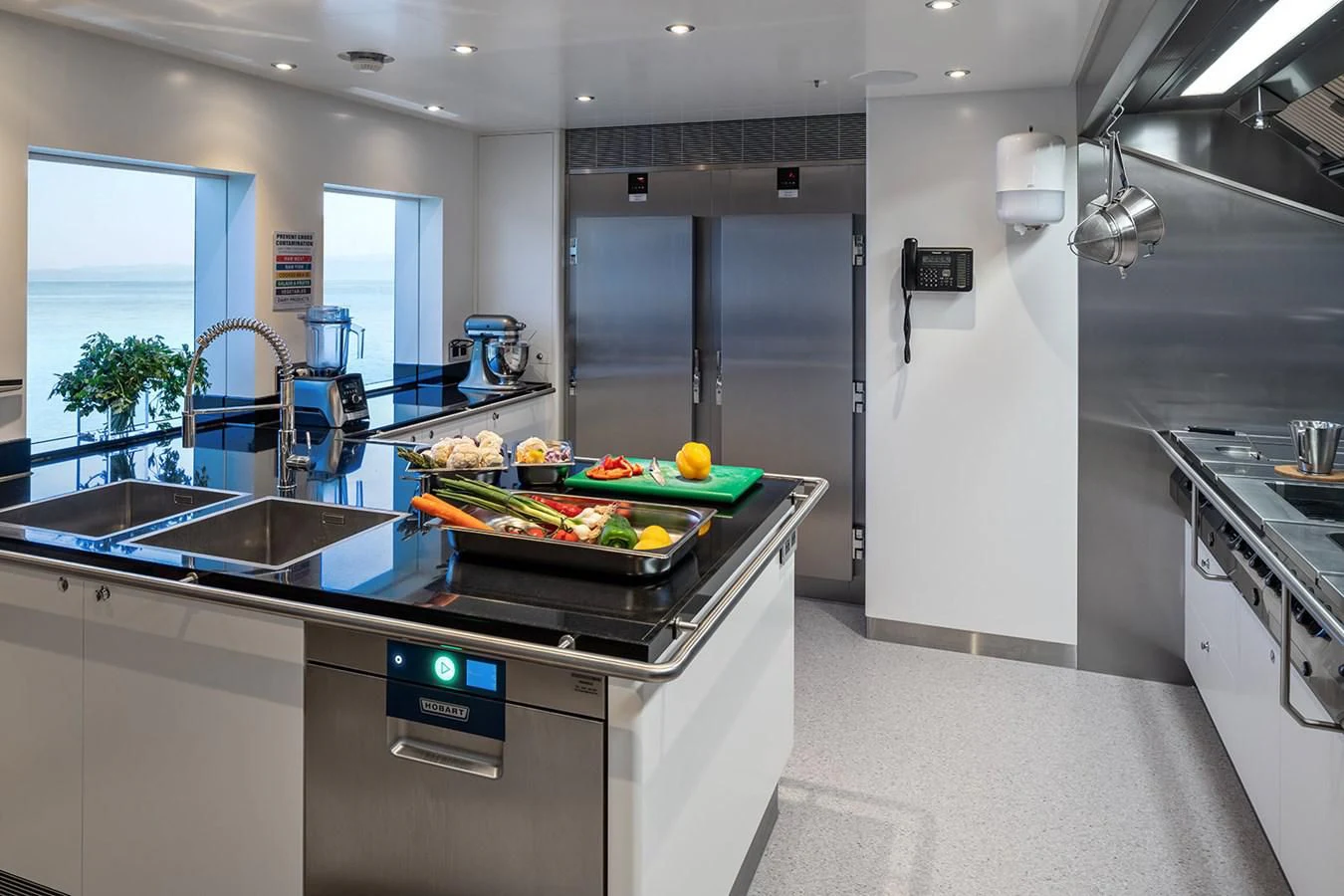 a kitchen with a large island aboard LUSINE Yacht for Sale