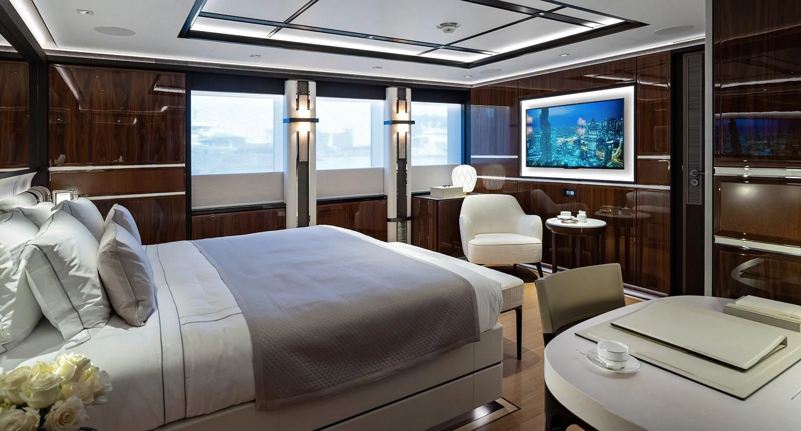 a room with a bed and a tv on the wall aboard LUSINE Yacht for Sale