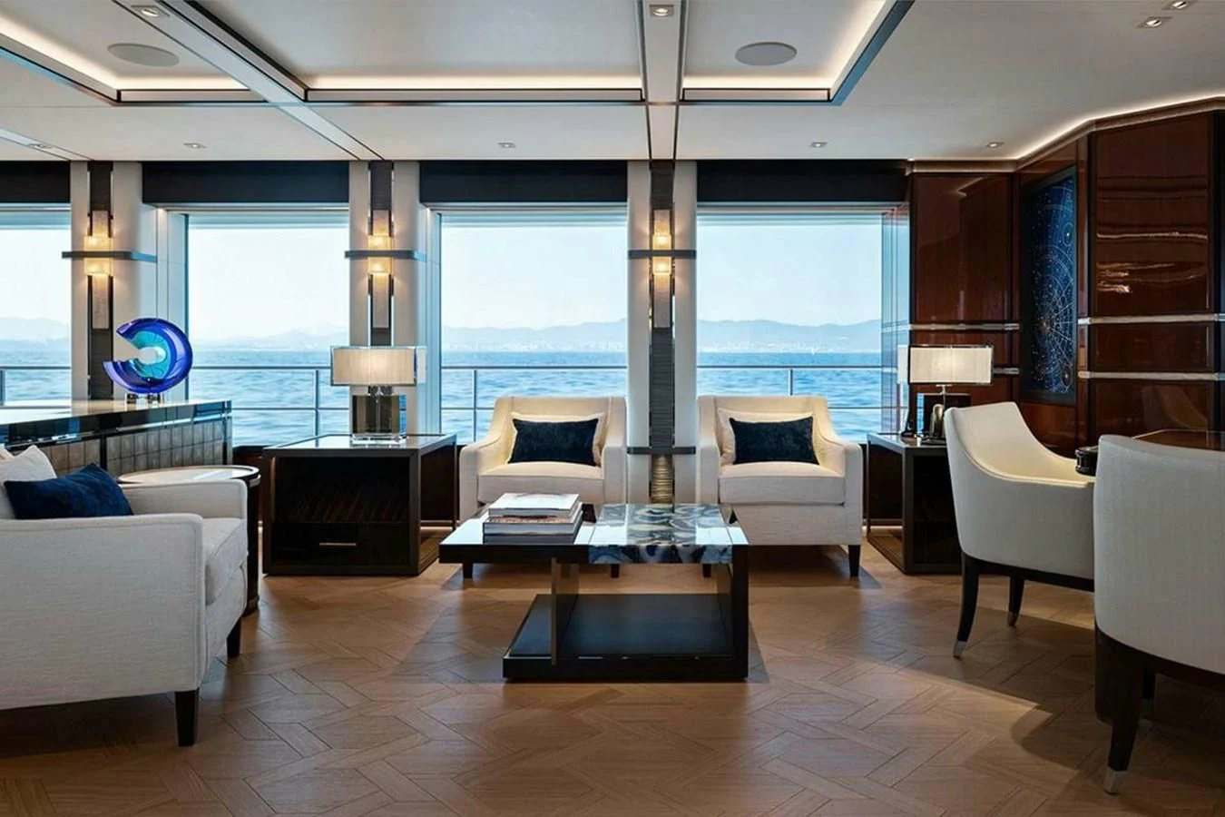 a living room with a large window aboard LUSINE Yacht for Sale