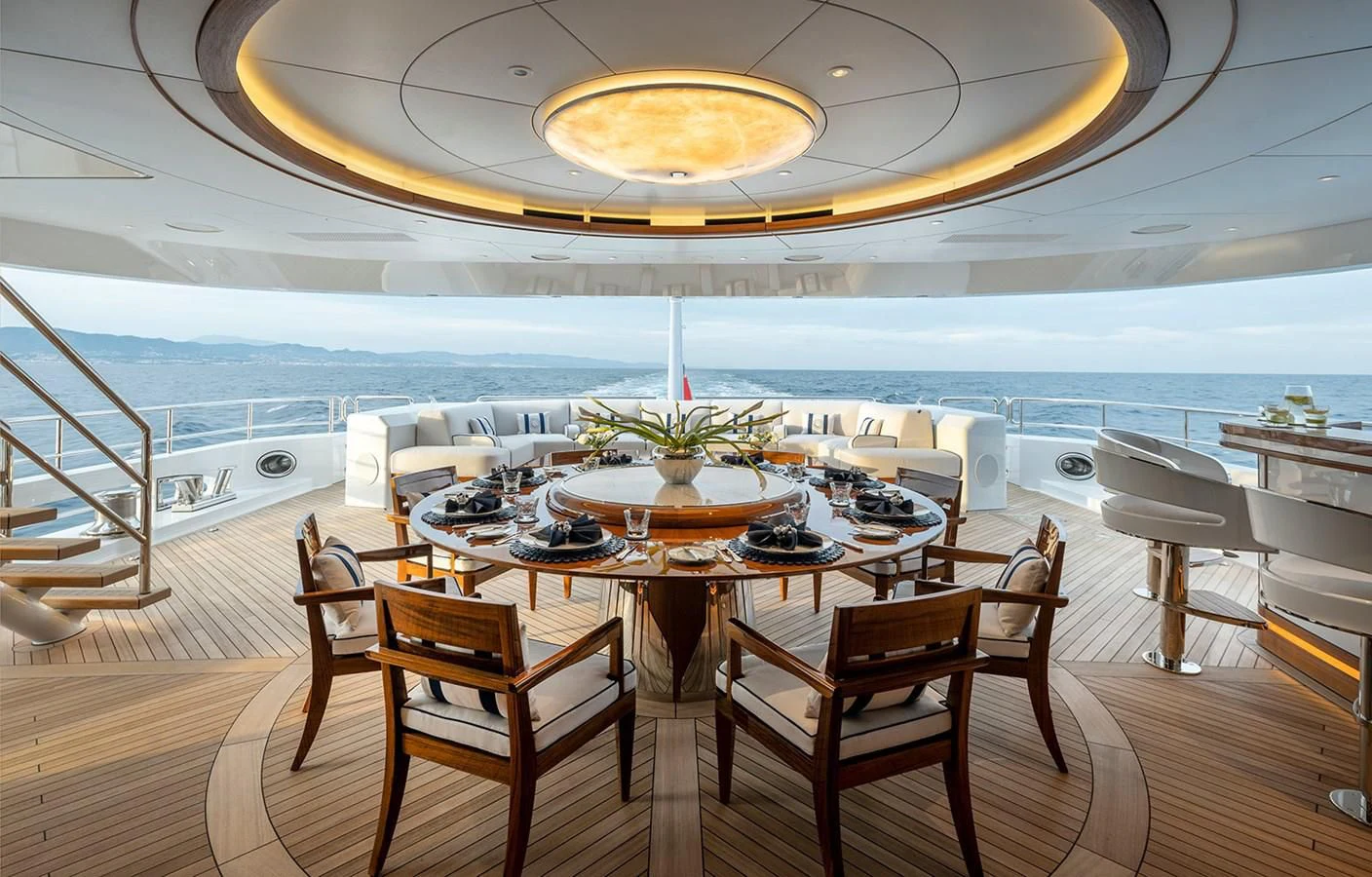 a room with tables and chairs aboard LUSINE Yacht for Sale