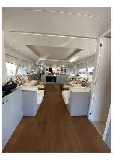 a large kitchen with a wood floor aboard MONKEY BUSINESS Yacht for Sale