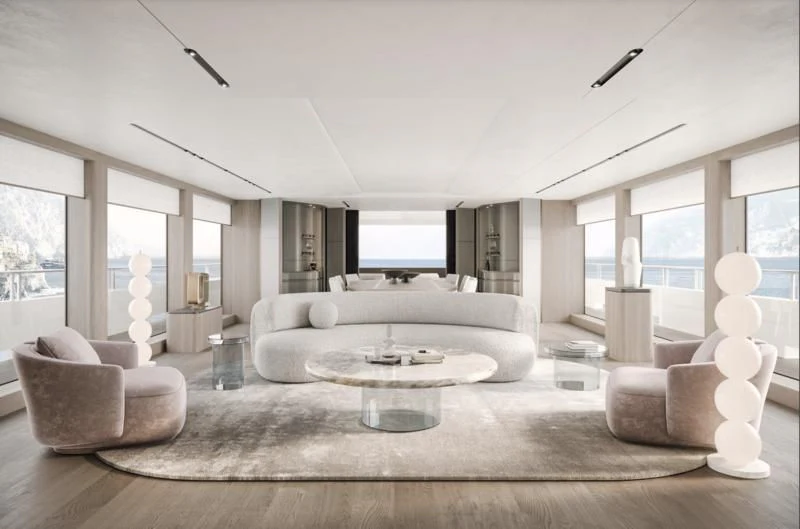 a living room with a large white sofa and a large window aboard ENTOURAGE Yacht for Sale