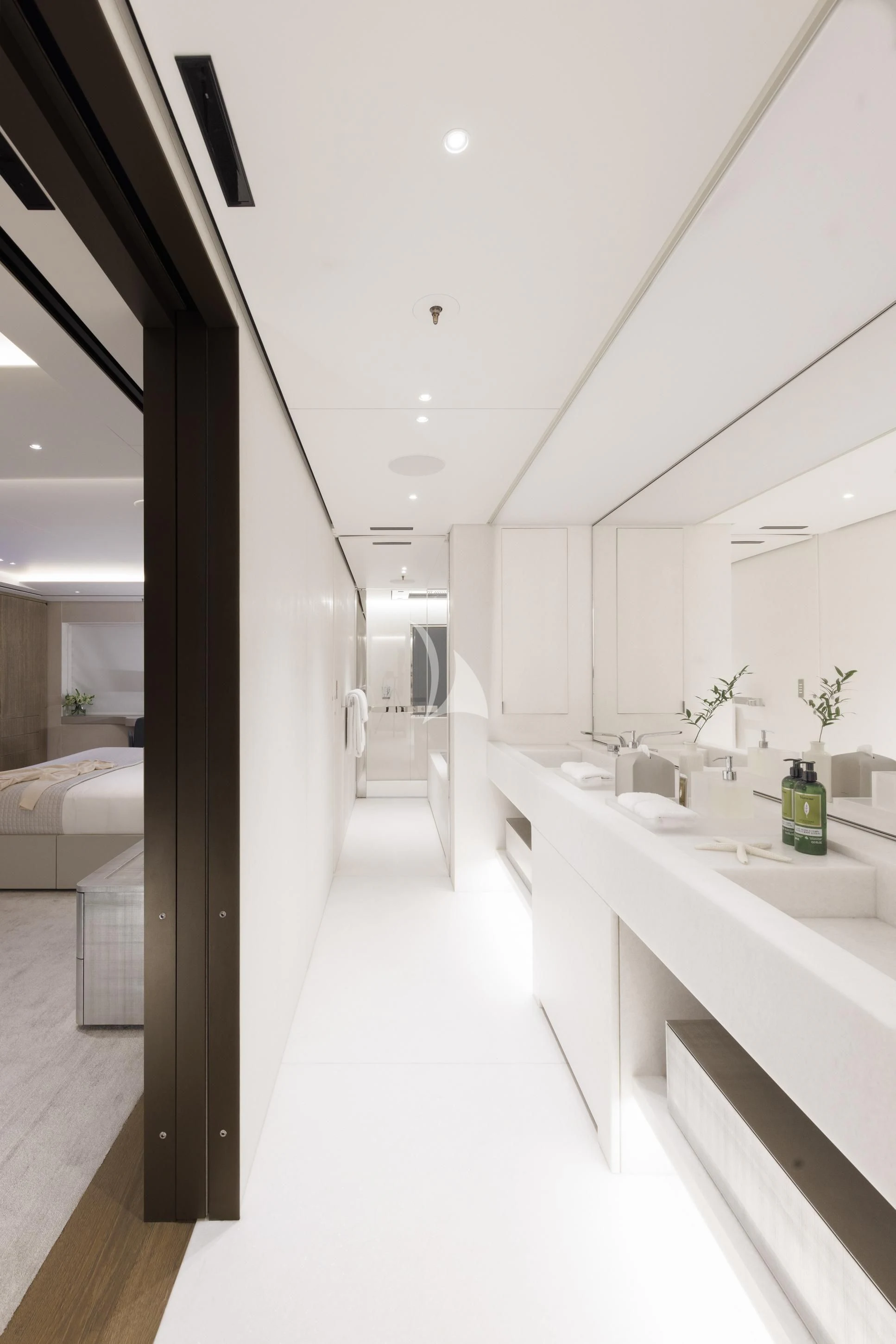 a modern bathroom with white walls aboard ENTOURAGE Yacht for Sale