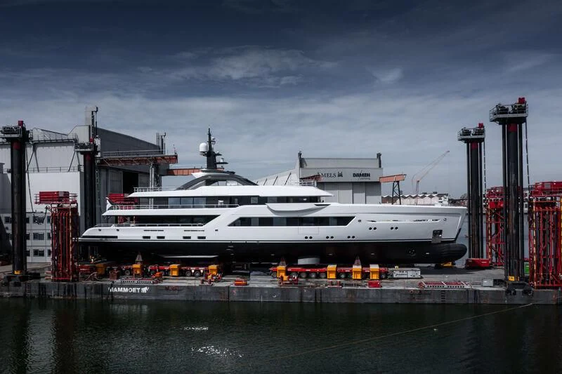 a white and black passenger train aboard ENTOURAGE Yacht for Sale