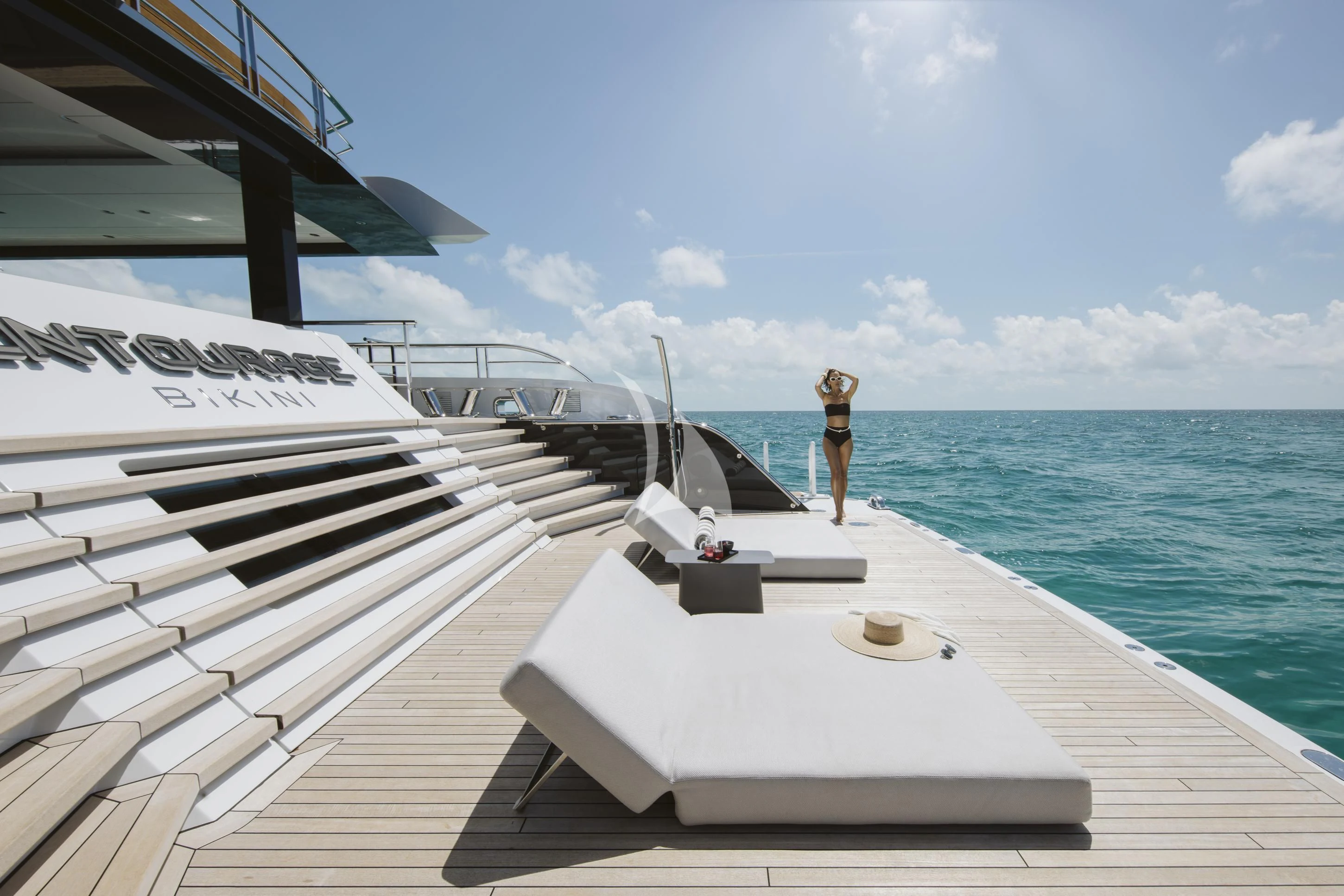 a person standing on a dock aboard ENTOURAGE Yacht for Sale