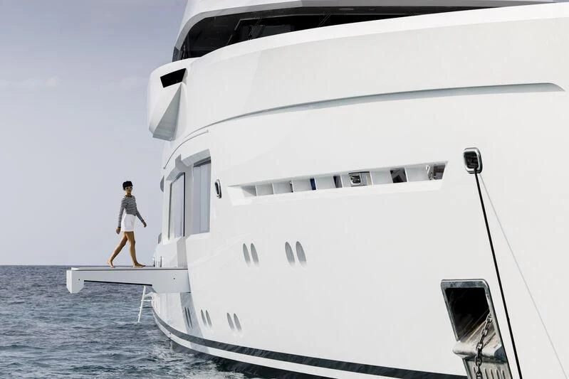 a person walking on a boat aboard ENTOURAGE Yacht for Sale