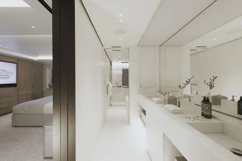 a room with white furniture aboard ENTOURAGE Yacht for Sale