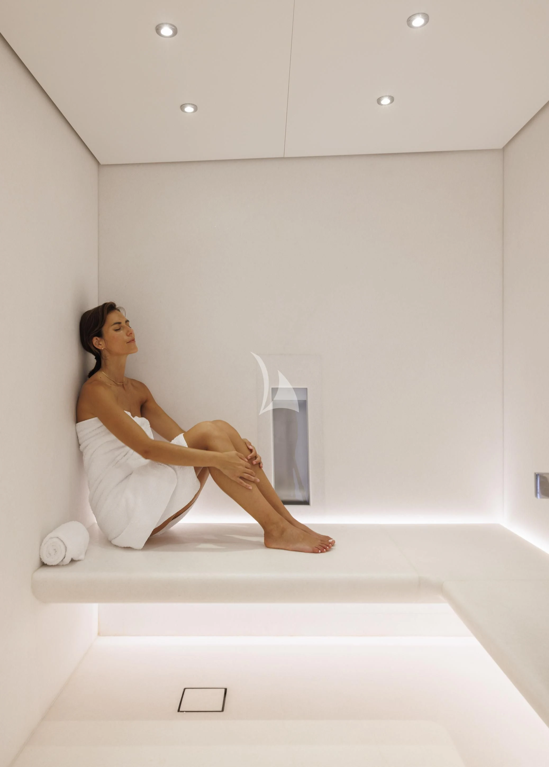 a person sitting on a white bathtub aboard ENTOURAGE Yacht for Sale