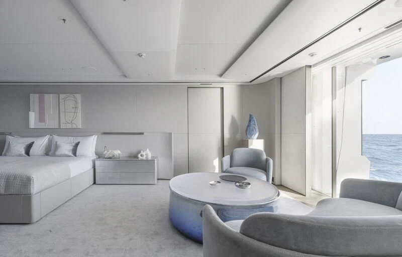 a living room with a couch and a table aboard ENTOURAGE Yacht for Sale