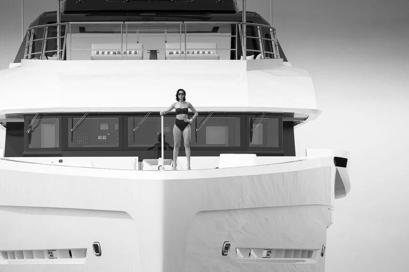 a person standing on a boat aboard ENTOURAGE Yacht for Sale
