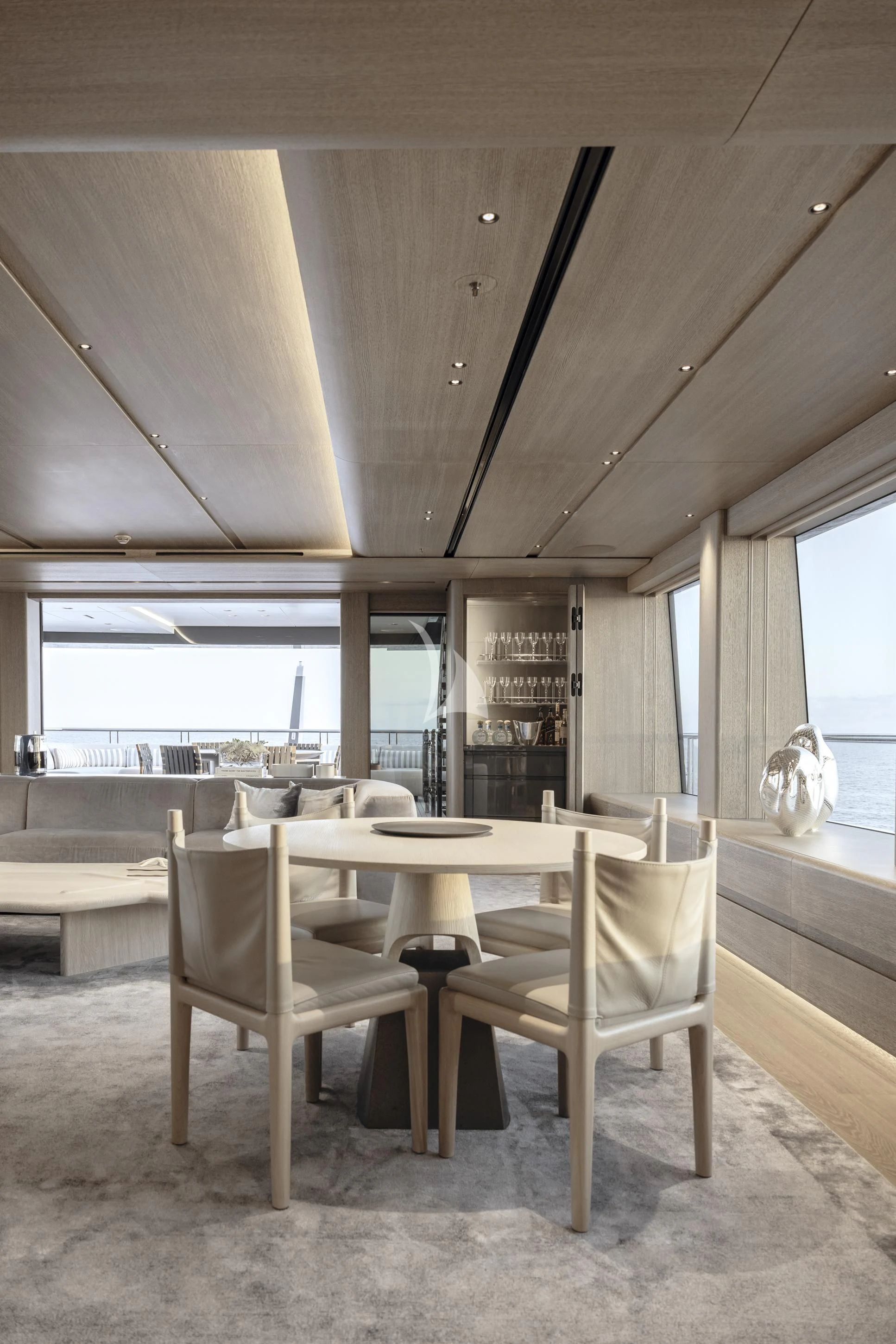 a room with a table and chairs aboard ENTOURAGE Yacht for Sale