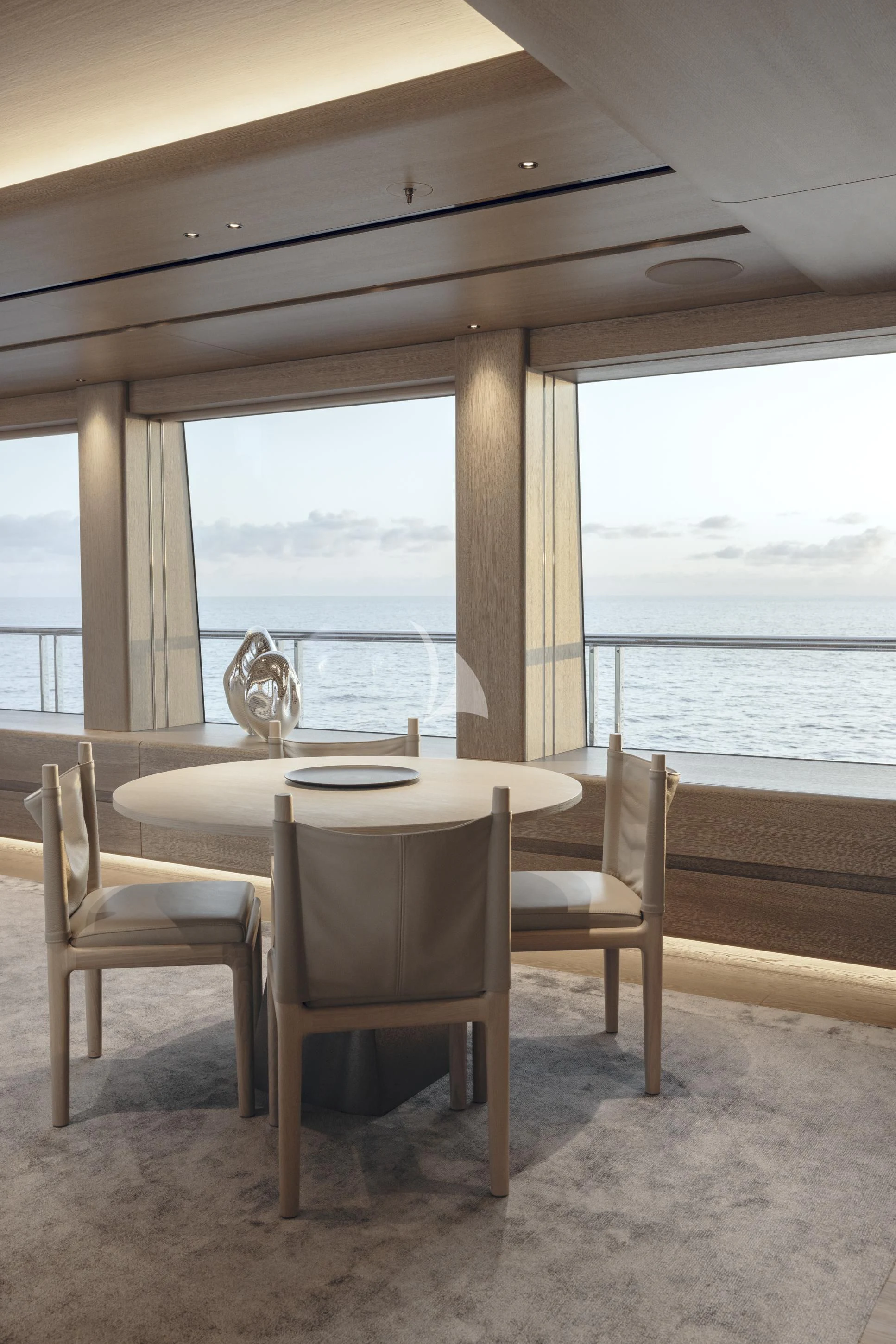 a table and chairs on a balcony aboard ENTOURAGE Yacht for Sale