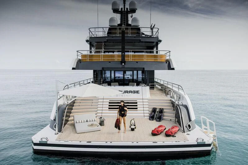 a boat with a person standing on it aboard ENTOURAGE Yacht for Sale