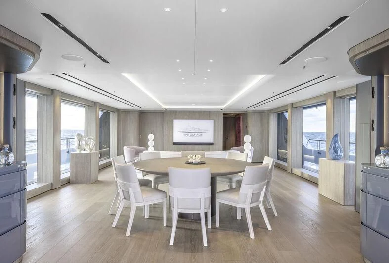 a large kitchen with a dining table aboard ENTOURAGE Yacht for Sale
