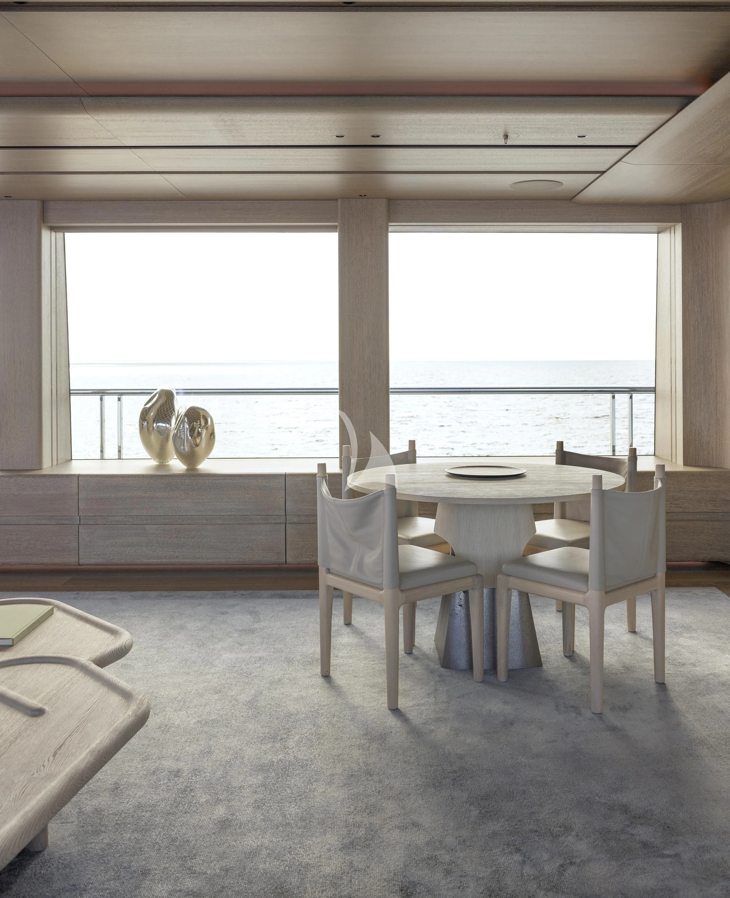 a room with a table and chairs aboard ENTOURAGE Yacht for Sale