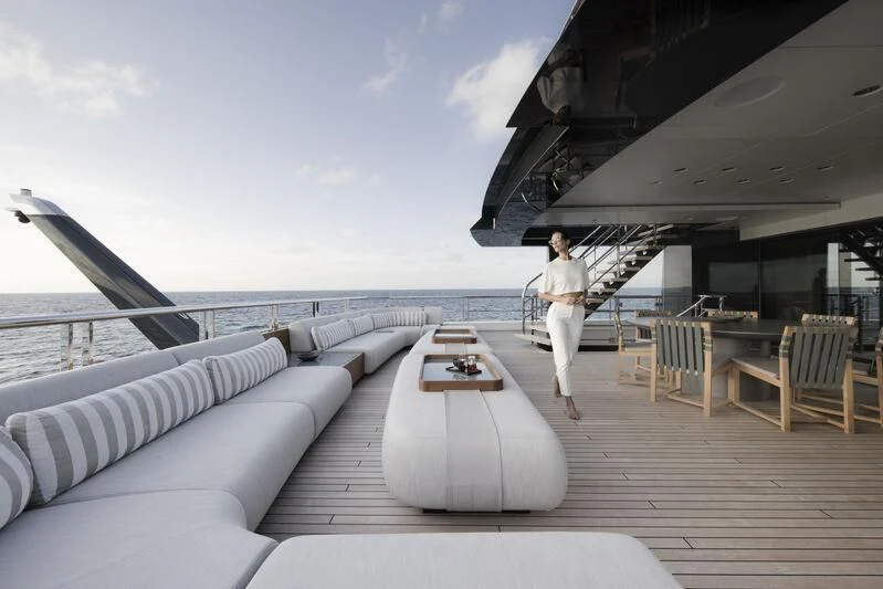 a person walking on a boardwalk aboard ENTOURAGE Yacht for Sale
