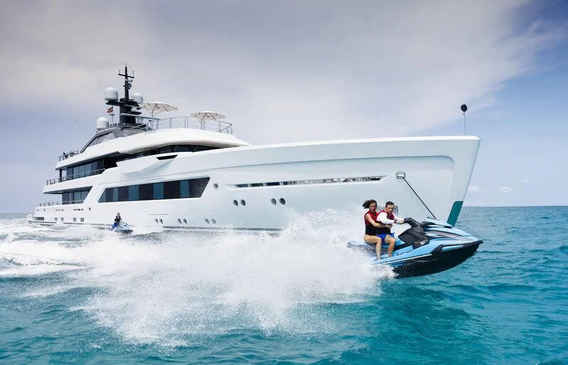 a couple of people on a boat in the water aboard ENTOURAGE Yacht for Sale