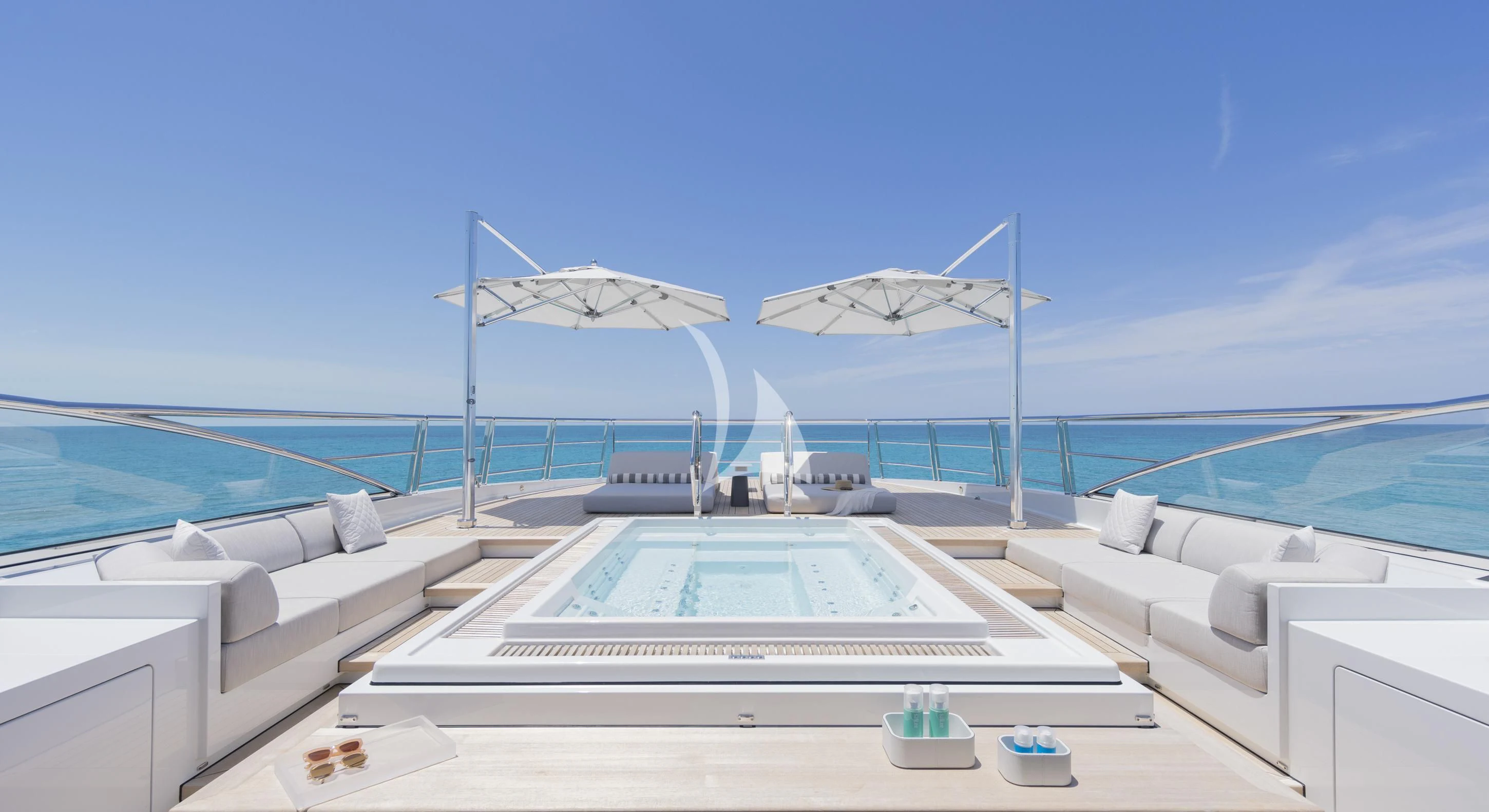 a large white boat on a body of water aboard ENTOURAGE Yacht for Sale
