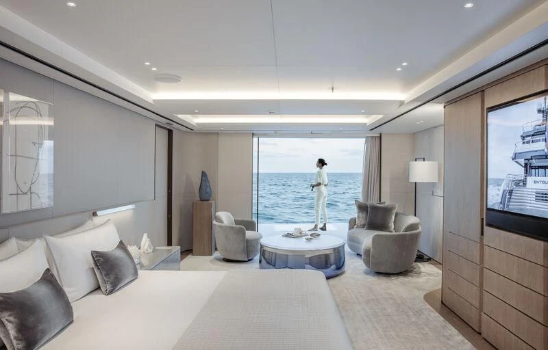 a person standing in a hotel room aboard ENTOURAGE Yacht for Sale