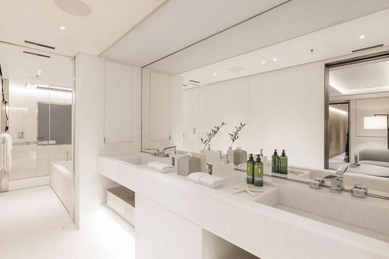 a bathroom with a countertop sink and a mirror aboard ENTOURAGE Yacht for Sale