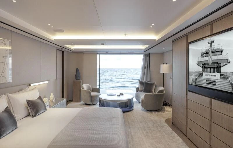 a bedroom with a large window aboard ENTOURAGE Yacht for Sale