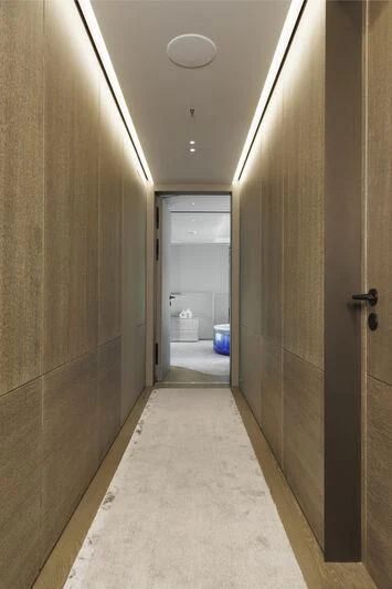 a hallway with a door and a toilet aboard ENTOURAGE Yacht for Sale