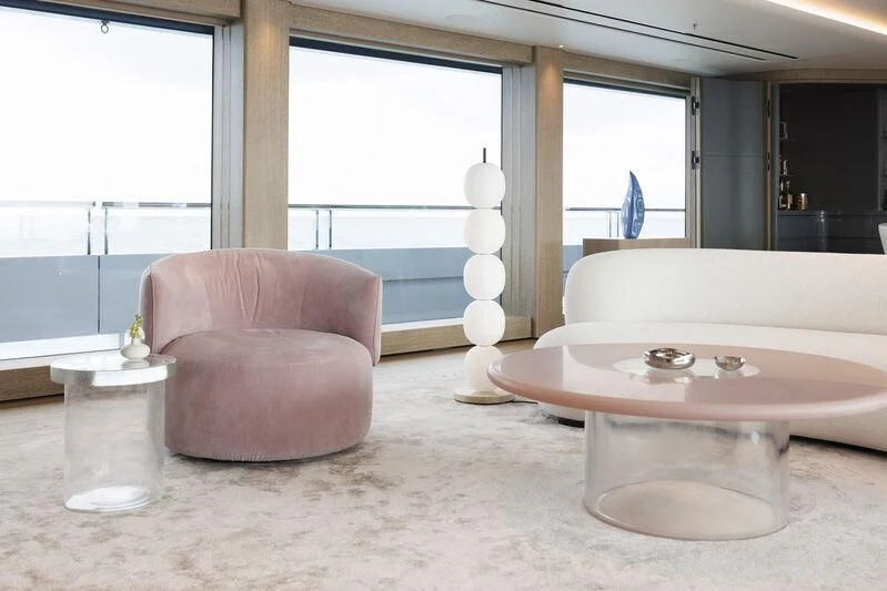 a room with a table and a couch aboard ENTOURAGE Yacht for Sale