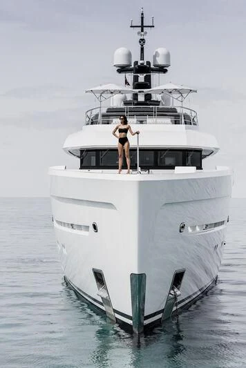 a person standing on a boat aboard ENTOURAGE Yacht for Sale