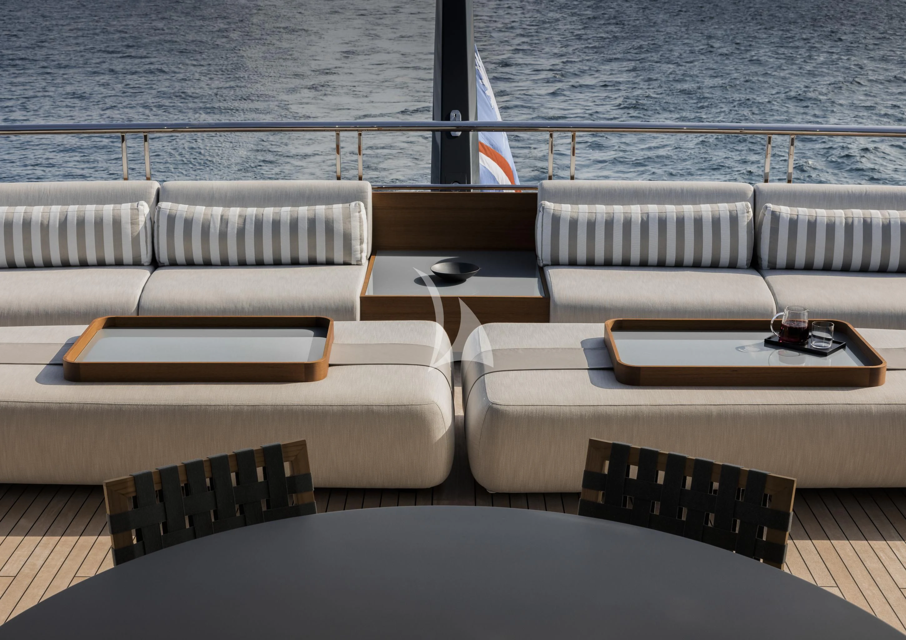 a table and chairs on a deck aboard ENTOURAGE Yacht for Sale