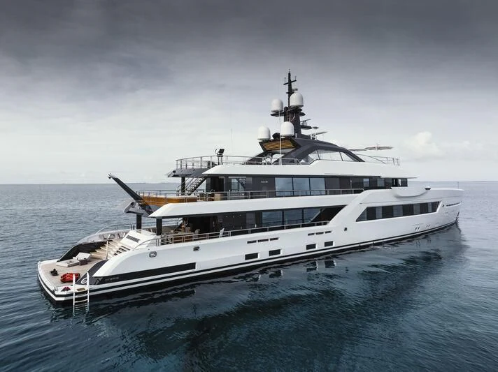a large white yacht in the water aboard ENTOURAGE Yacht for Sale