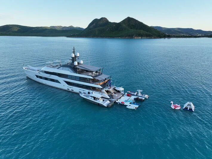 a large ship in the water aboard ENTOURAGE Yacht for Sale